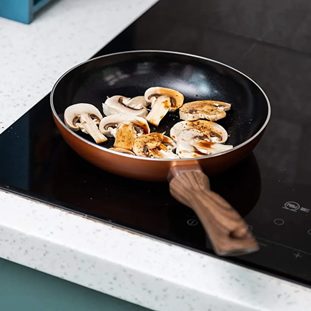 Nuovva Kupfer Bratpfanne - Keramische Antihaftbeschichtung - Holzgriff Bratpfanne - Ø 24 Cm Induktion - PTFE-frei 9 Nuovva Kupfer Bratpfanne - Keramische Antihaftbeschichtung - Holzgriff Bratpfanne - Ø 24 Cm Induktion - PTFE-frei – Bild 7